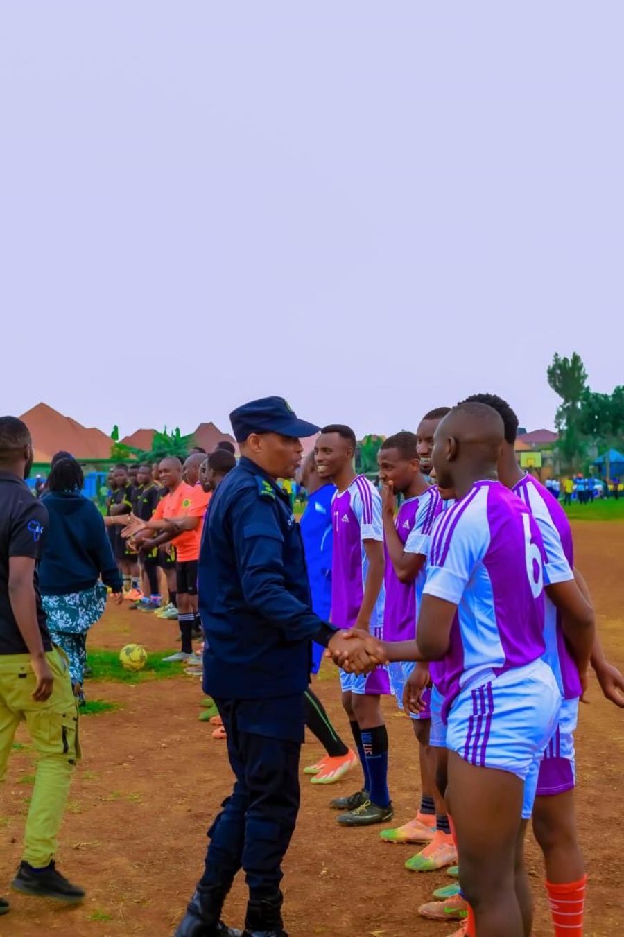 District leadership greeting players before a friendly match in Rusizi